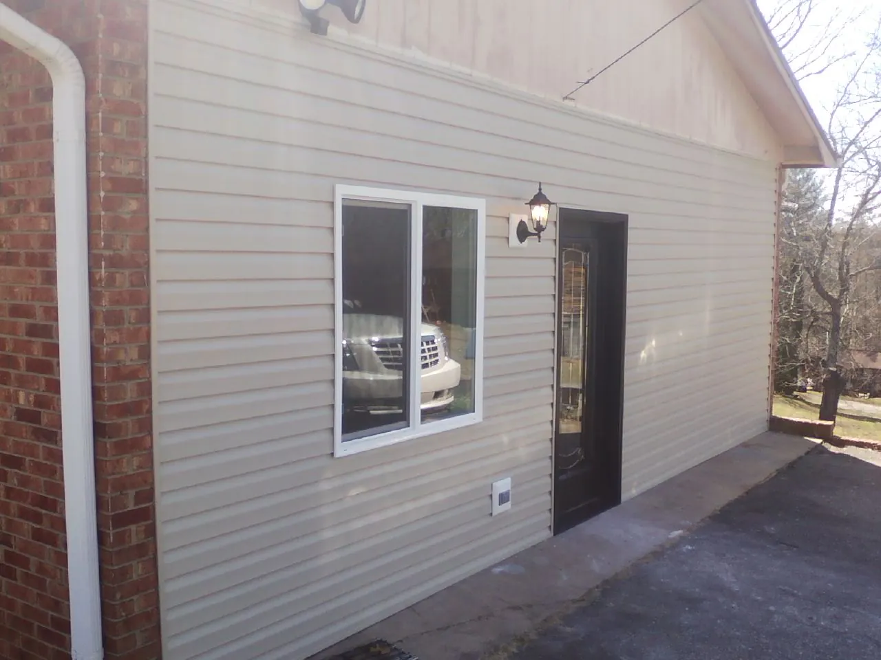New vinyl siding and entry door on a room addition in Wetumpka